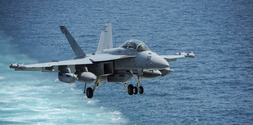 An EA-18G Growler assigned to the Rooks of Electronic Attack Squadron (VAQ) 137 prepares to land on the flight deck aboard the aircraft carrier USS Theodore Roosevelt (CVN 71).