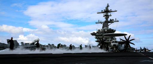 Sailors perform a no-load evolution on a catapult on the flight deck of the Nimitz-class aircraft carrier USS Abraham Lincoln (CVN 72).
