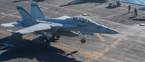  An F/A-18E Super Hornet, from the “Mighty Shrikes” of Strike Fighter Squadron (VFA) 94, makes an arrested landing on the flight deck of the aircraft carrier USS Nimitz. Nimitz