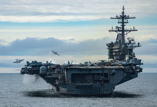 Two F/A-18 Super Hornets, assigned to Carrier Air Wing (CVW) 11, launch from the flight deck of the aircraft carrier USS Theodore Roosevelt (CVN-71)