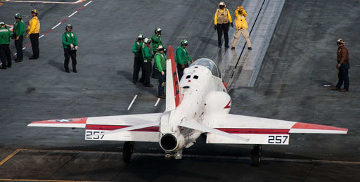 Sailors prepare a T-45C Goshawk attached to the "Redhawks" of Training Squadron (VT) 21 to launch off of the flight deck of the aircraft carrier USS George H.W. Bush (CVN 77).