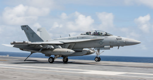  An EA-18G Growler, from the “Shadowhawks” of Electronic Attack Squadron (VAQ) 141, performs a touch-and-go on the flight deck of the Navy’s only forward-deployed aircraft carrier, USS Ronald Reagan (CVN 76)