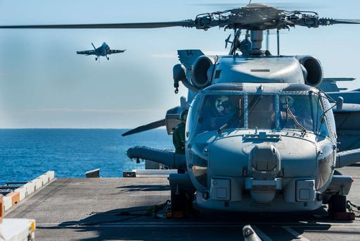 A Helicopter Maritime Strike Squadron (HSM) 78 "Black Hawks" MH-60R Sea Hawk Helicopter prepares to take off from the aircraft carrier USS Carl Vinson (CVN 70) flight deck. 