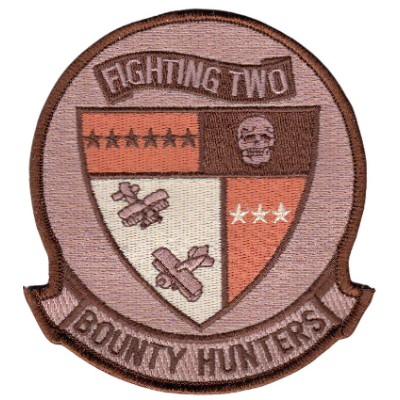 Circle patch with bottom banner with text "bounty hunters". Desert background with desert outline.